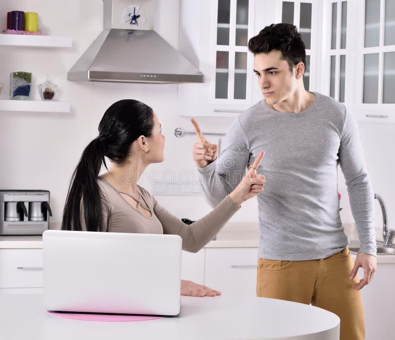 Unhappy couple in the kitchen
