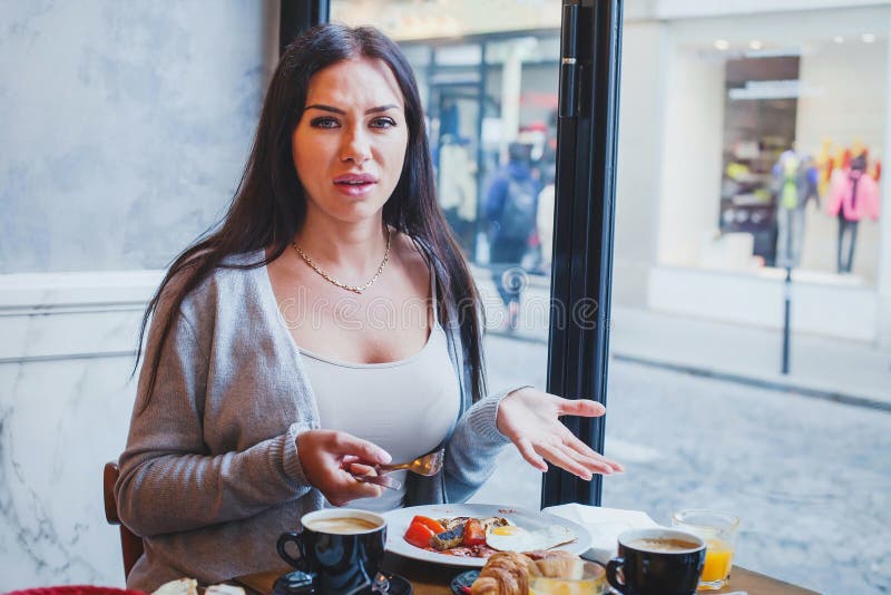 Unhappy customer in restaurant, angry woman