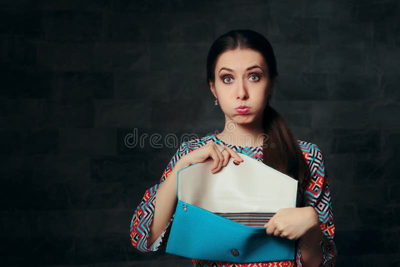 Exigent fashion girl looking to see if the purse is a fake replica. Exigent fashion girl looking to see if the purse is a fake replica