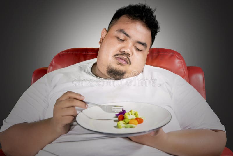 Unhappy Fat Man Eating a Plate of Healthy Food Stock Photo - Image of dark,  indonesian: 140721962