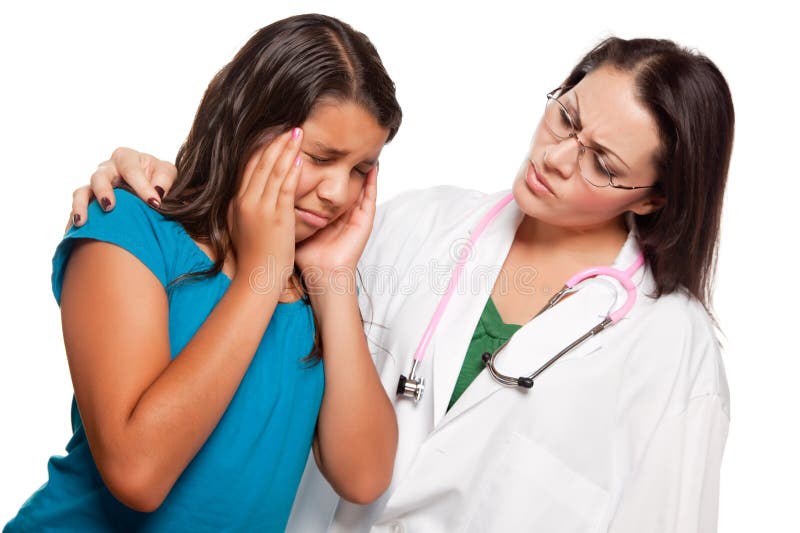Unhappy Hispanic Girl and Concerned Female Doctor royalty free stock photography Unhappy Hispanic Girl and Concerned Female Doctor royalty free stock photography