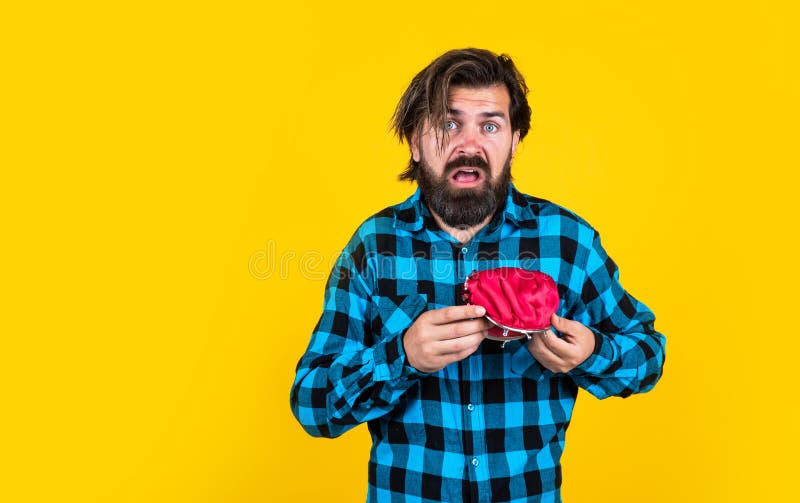 unhappy man hold purse. poor man need some money. loan in crises. have money saving. ready to go shopping. bearded