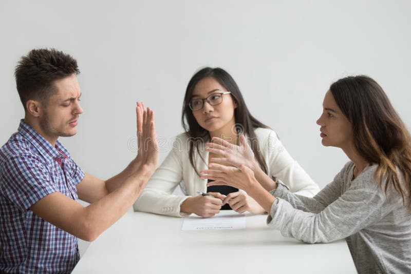 Unhappy married couple get divorced arguing fighting in lawyer office, disappointed husband refusing to pay alimony or sign decree paper, custody battle, family separation, divorce settlement concept. Unhappy married couple get divorced arguing fighting in lawyer office, disappointed husband refusing to pay alimony or sign decree paper, custody battle, family separation, divorce settlement concept