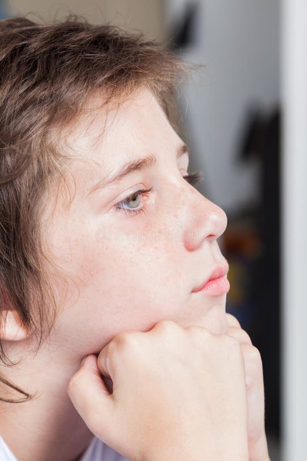 Unhappy sad boy, face close up portrait stressed child. Unhappy sad boy, face close up portrait stressed child