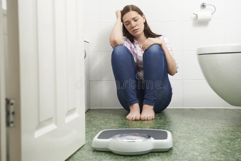 https://thumbs.dreamstime.com/b/unhappy-teenage-girl-sitting-floor-looking-bathroom-scales-59230735.jpg