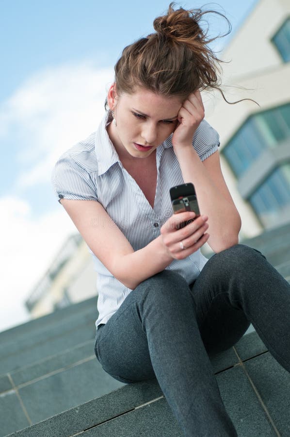 Unhappy woman with mobile phone stock photos