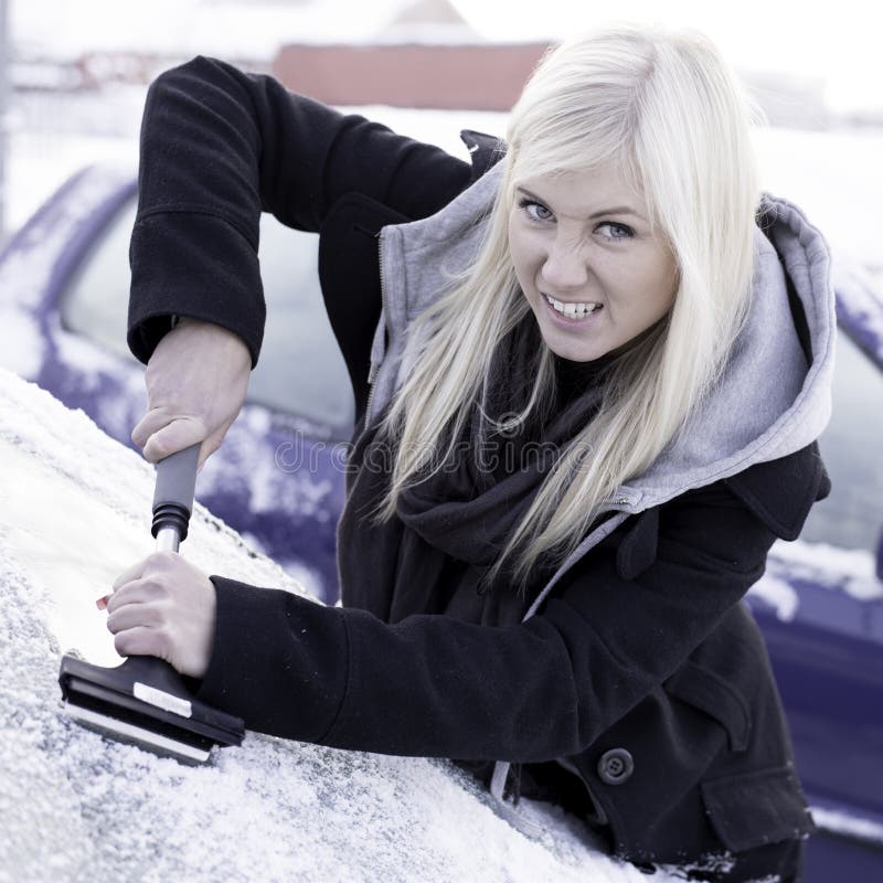 Unhappy woman scraping ice royalty free stock image