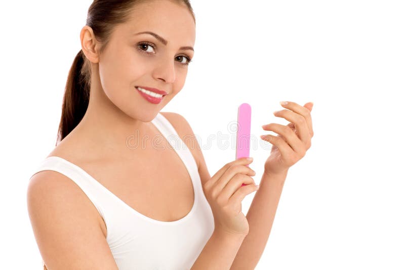 Unhas do arquivamento da mulher imagens de stock Unhas do arquivamento da mulher imagens de stock