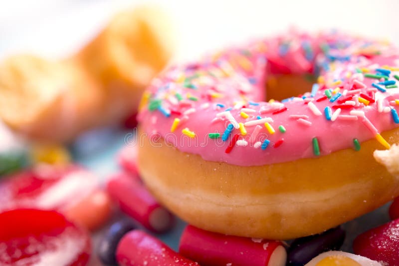 Unhealthy but delicious group of sweet sugar donut cakes and lot