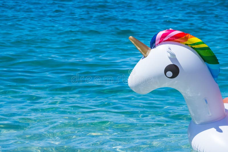 Unicorn swim tube on the beach, Koh Lipe, Satun, ThailandInflatable unicorn.Fantasy Swim Ring for Summer Pool. Unicorn swim tube on the beach, Koh Lipe, Satun, ThailandInflatable unicorn.Fantasy Swim Ring for Summer Pool