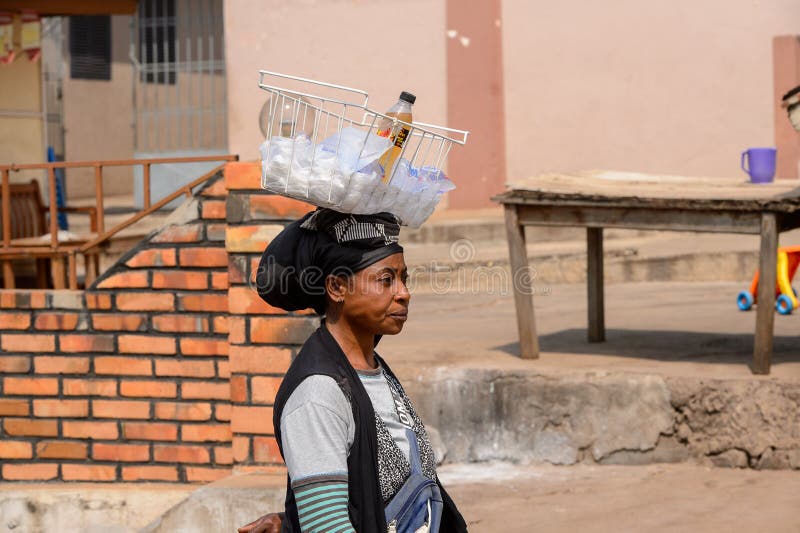 Unidentified Ghanaian Woman Carries A Basket On Her Head In Loc