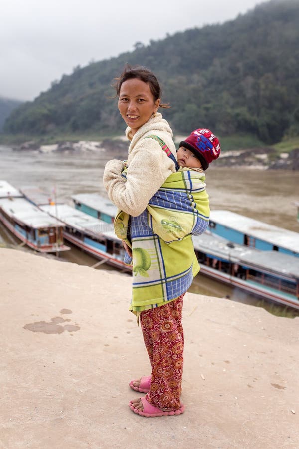 Unidentified laotian Mother and child in the village Pak Beng on the Mekong river in Laos. royalty free stock photos Unidentified laotian Mother and child in the village Pak Beng on the Mekong river in Laos. royalty free stock photos