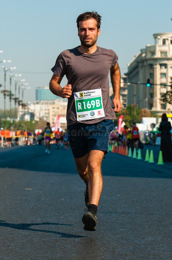 Unidentified marathon runner competes stock photography