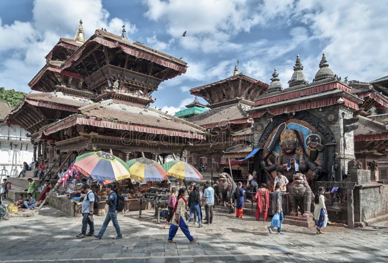 Unidentified nepalese people at Kathmandu Durbar Square, UNESCO World Heritage Site, surrounded with spectacular architecture royalty free stock photos