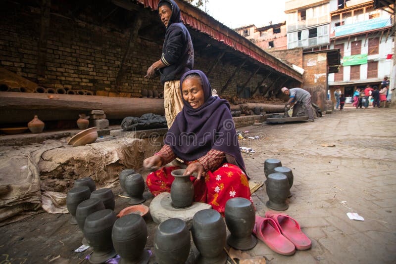 Unidentified Nepalese woman working in the his pottery workshop. royalty free stock images