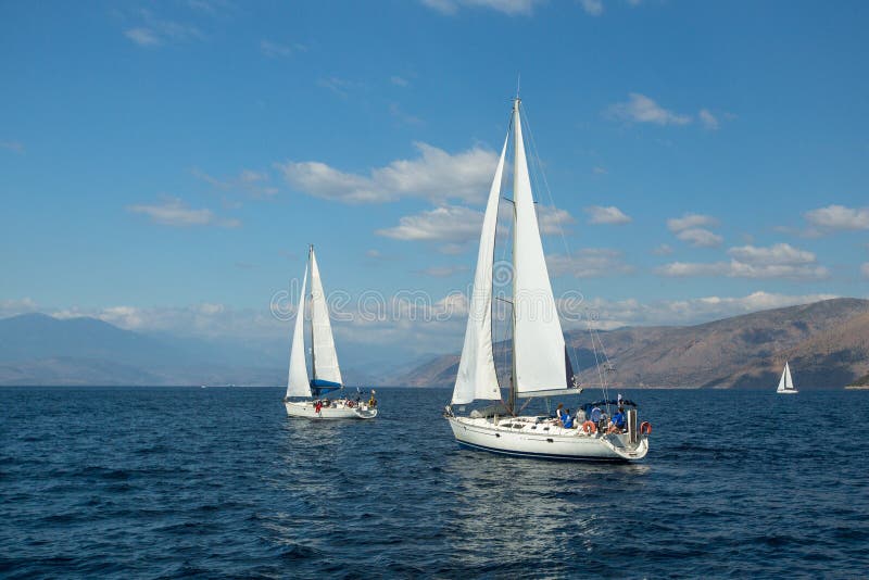 Unidentified sailboats participate in sailing regatta