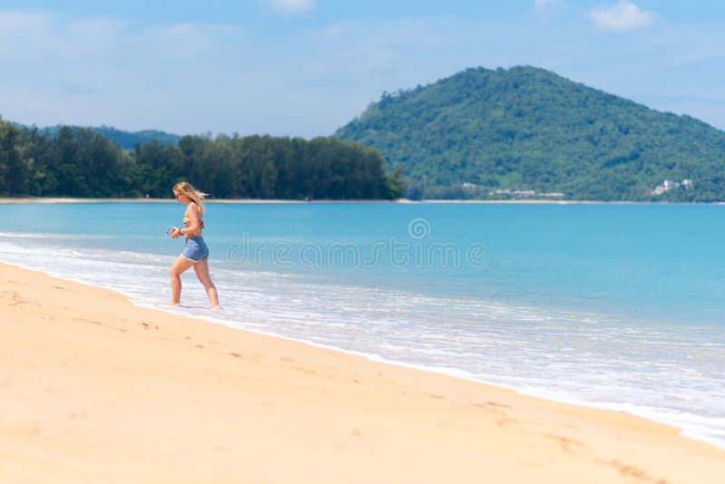 Unidentified tourists at Mai Khao beach near Phuket International Airport