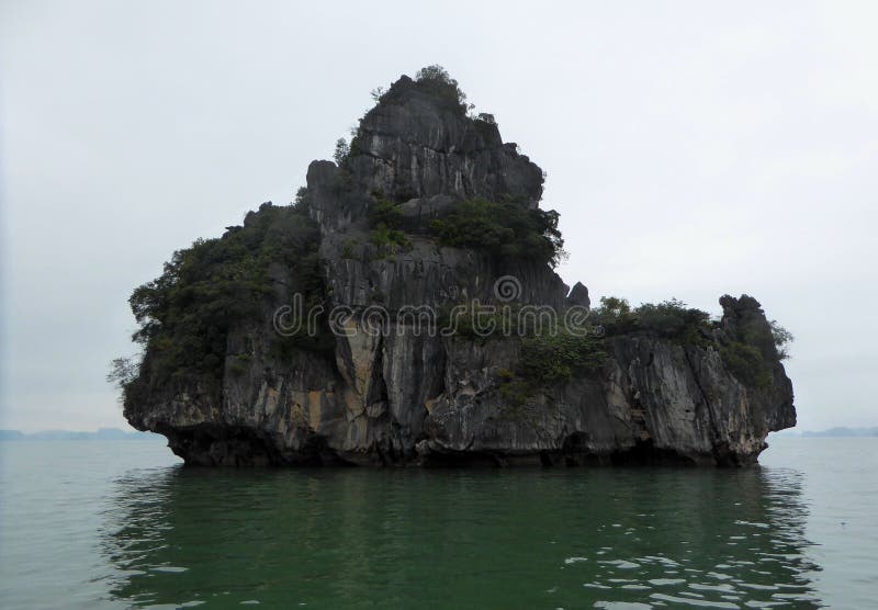 A lonely unique shaped islands of ha long bay Vietnam. A lonely unique shaped islands of ha long bay Vietnam.