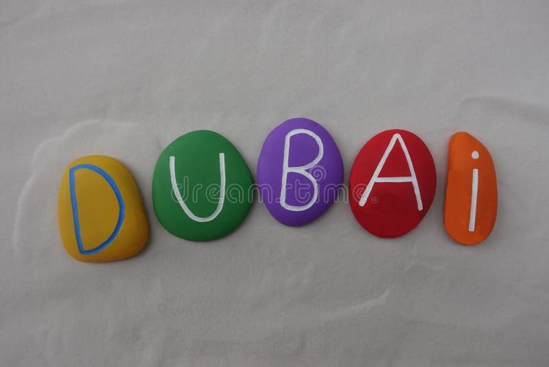 Dubai, United Arab Emirates, souvenir with a multi colored stones composition over white sand stock photography Dubai, United Arab Emirates, souvenir with a multi colored stones composition over white sand stock photography