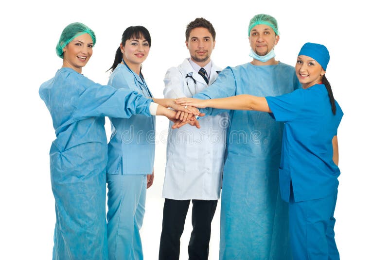 United doctors team standing with their hands on top each other isolated on white background. Top smiling cheerful stock images, royalty-free photos and pictures