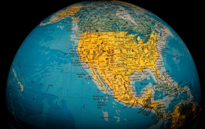 A view of the United States on an illuminated globe against a black background. A view of the United States on an illuminated globe against a black background.