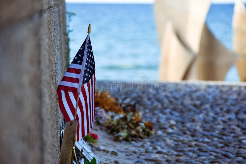 United States and Canadian flags, flowers and objects in memory of fallen in Normandy landing. stock photos United States and Canadian flags, flowers and objects in memory of fallen in Normandy landing. stock photos