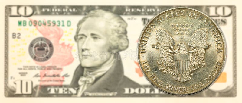 1 united states silver dollar coin against 10 us-dollar note stock photography 1 united states silver dollar coin against 10 us-dollar note stock photography