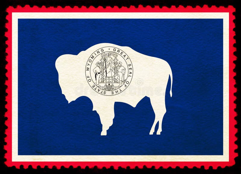 United States Wyoming state flag on the old grunge postage stamp isolated on black background