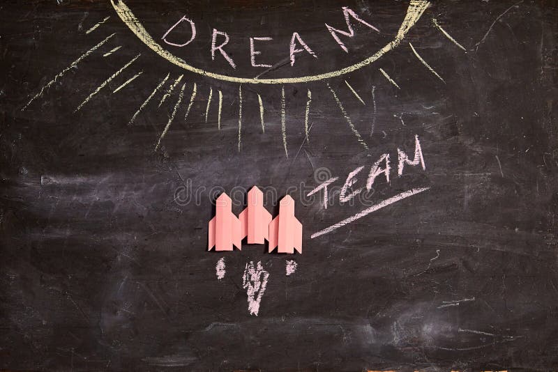 Unity and teamwork concept: Dreamteam, collaborate and cooperation. Three red rockets and the inscription dream team stock photo Unity and teamwork concept: Dreamteam, collaborate and cooperation. Three red rockets and the inscription dream team stock photo