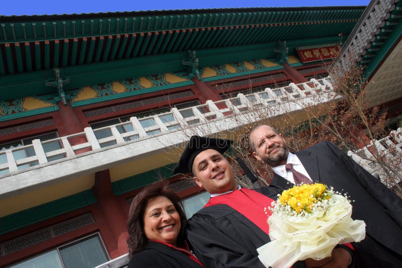 University graduate with his parents