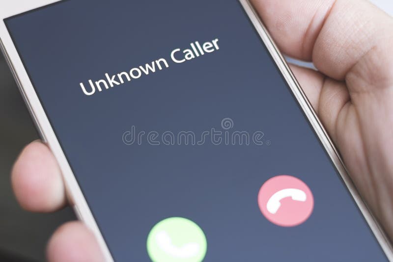 Unknown Caller. a Man Holds a Phone in His Hand and Thinks To End the