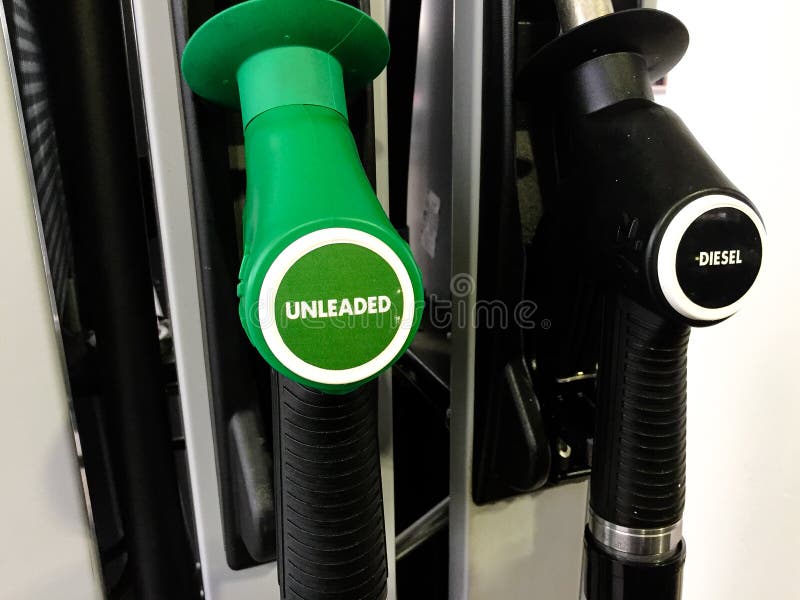 An Unleaded and Diesel Fuel Nozzles at a Service Station Stock Image