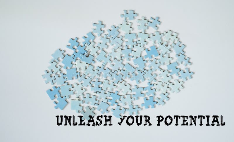 Unleash your potential,jigsaw puzzle and caption, creativity,idea,business, human resources concept royalty free stock image