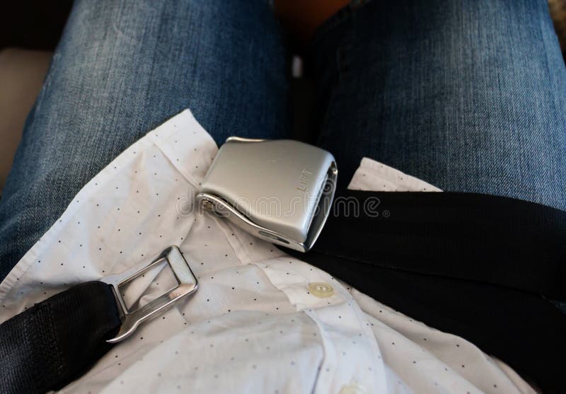 Unlocked Airplane Seat Belt Over Passenger Lap Stock Image Image of