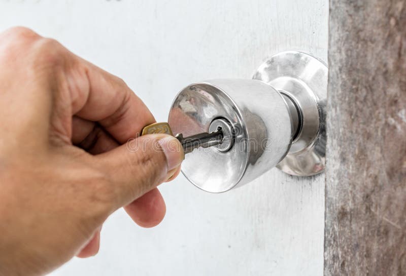 Unlocking Door With Key In Hand Stock Photo - Image of hand, entrance How To Unlock A Door With Key
