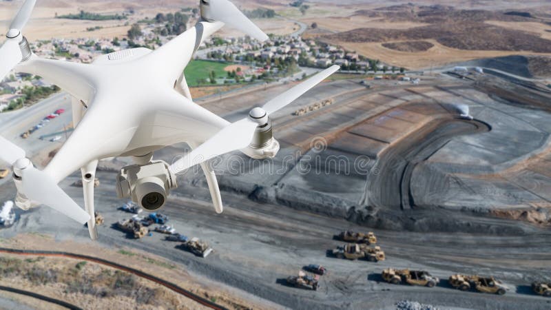 Unmanned Aircraft System UAV Quadcopter Drone In The Air Over