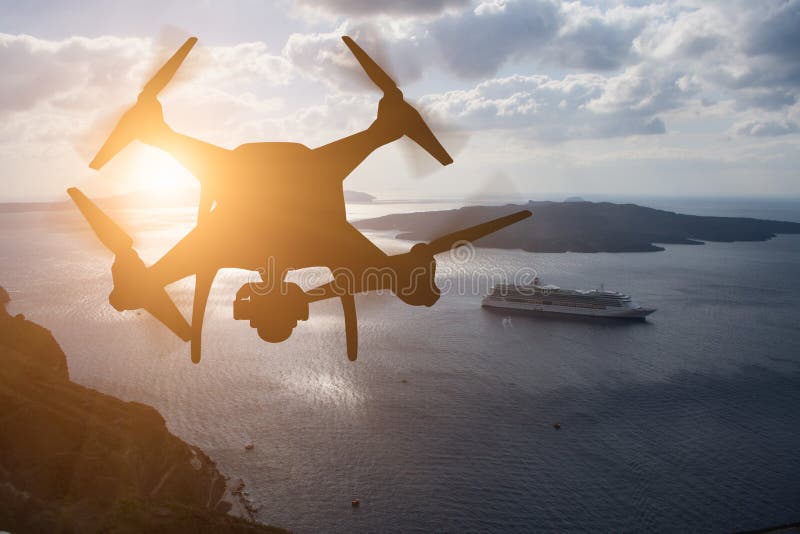 Unmanned Aircraft System UAV Quadcopter Drone In The Air At Su stock photography Unmanned Aircraft System UAV Quadcopter Drone In The Air At Su stock photography