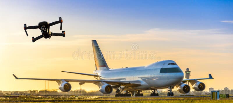 Unmanned drone flying near large commercial airplane at airport - flight disruption concept royalty free stock image Unmanned drone flying near large commercial airplane at airport - flight disruption concept royalty free stock image