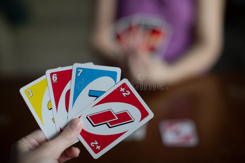 Playing American Card Game Uno, Holding Game Cards in Female Hand