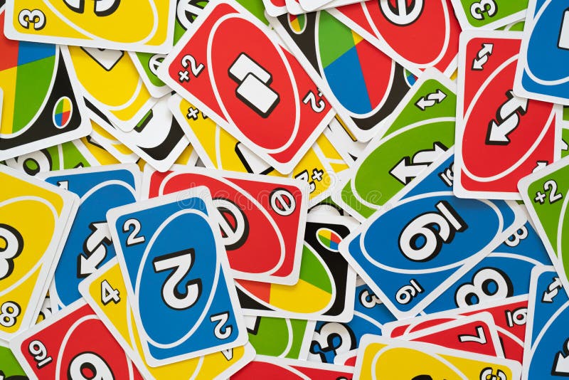 Deck of Uno Game Cards Scattered All Over on a Table. American