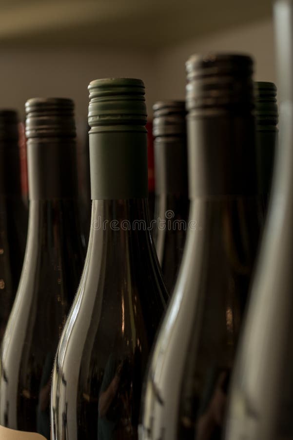 Unopened Dark Wine Bottles stock image.