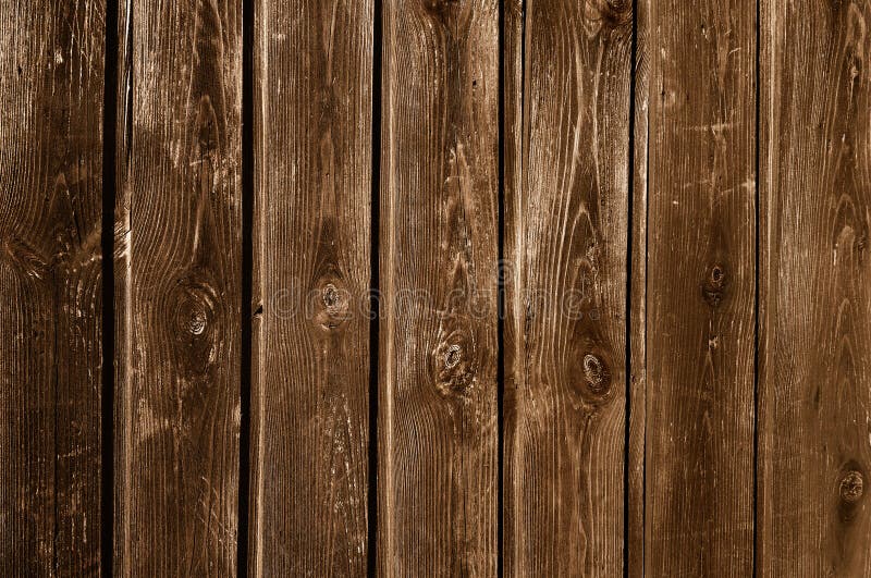 Darkened unpainted wooden fence stock image