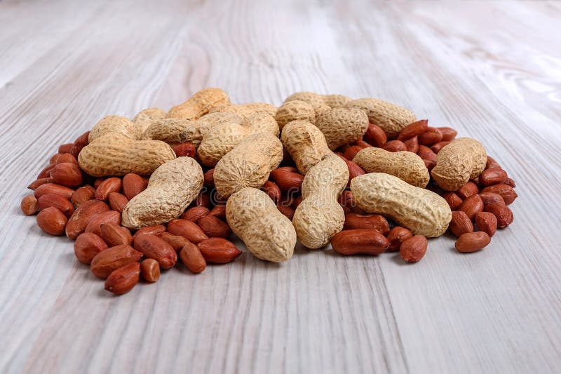 Unpeeled and Peeled Peanuts on the Kitchen Table. Stock Image Image