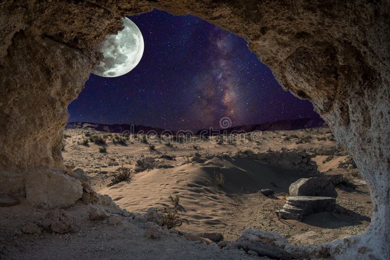 An unrealistic night landscape through a cave with milky, moon in eclipse, and desert with ruins of ancient columns.