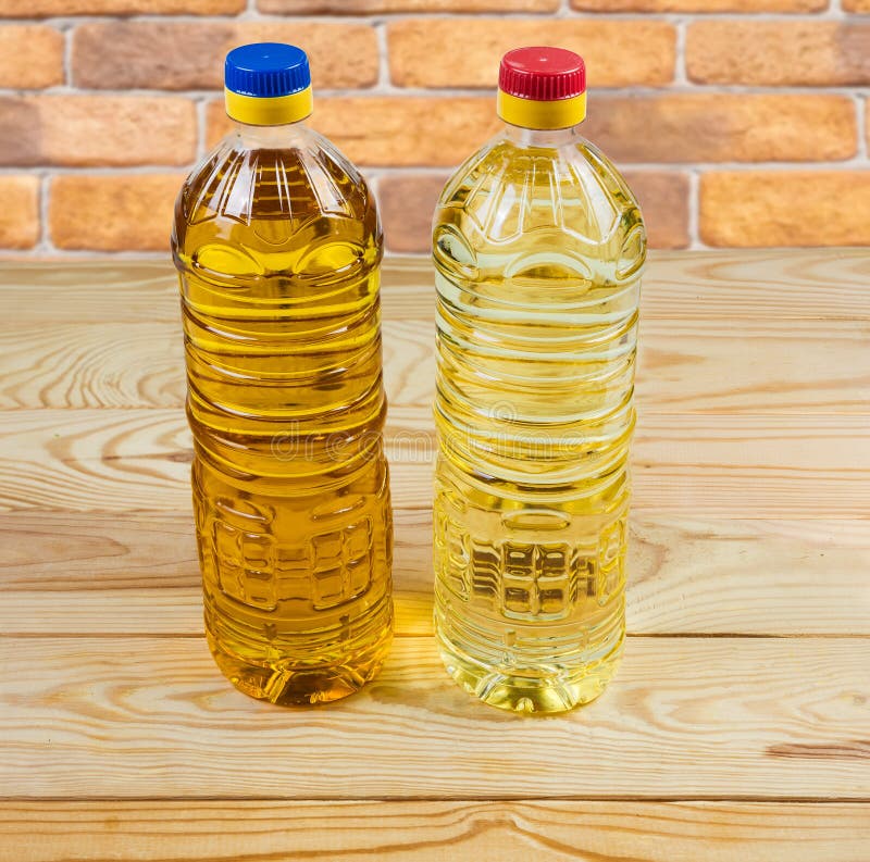 Unrefined Coldpressed and Refined Sunflower Oil in Two Bottles Stock