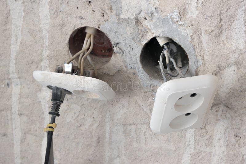 Unsafe Connection of the Cable To an Electrical Outlet Stock Photo