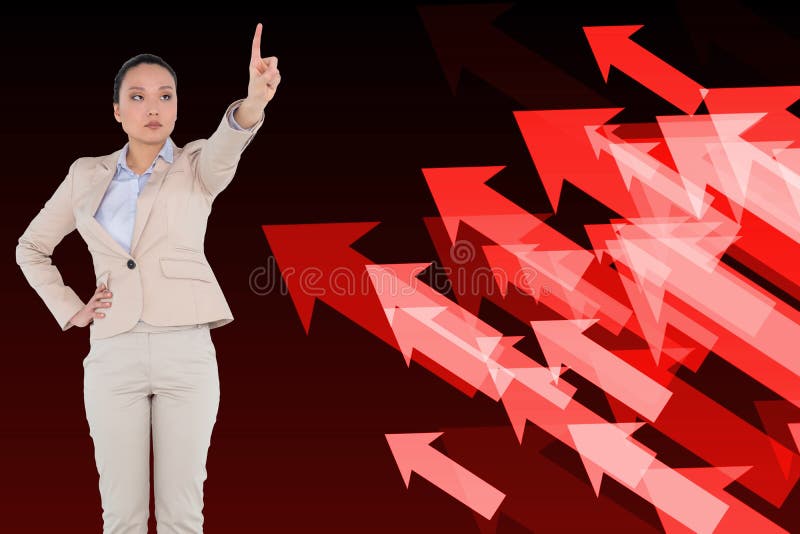 Unsmiling asian businesswoman pointing