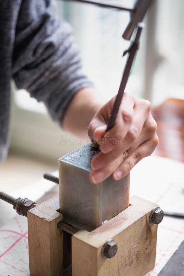 The unspecific girl engraving of the stone for logo stamp in Wuhan, This  is one of the ancient culture of China.