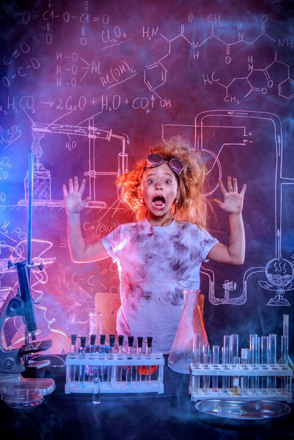 Funny little girl doing experiments in the laboratory. Explosion in the laboratory. Science and education. Funny little girl doing experiments in the laboratory. Explosion in the laboratory. Science and education.