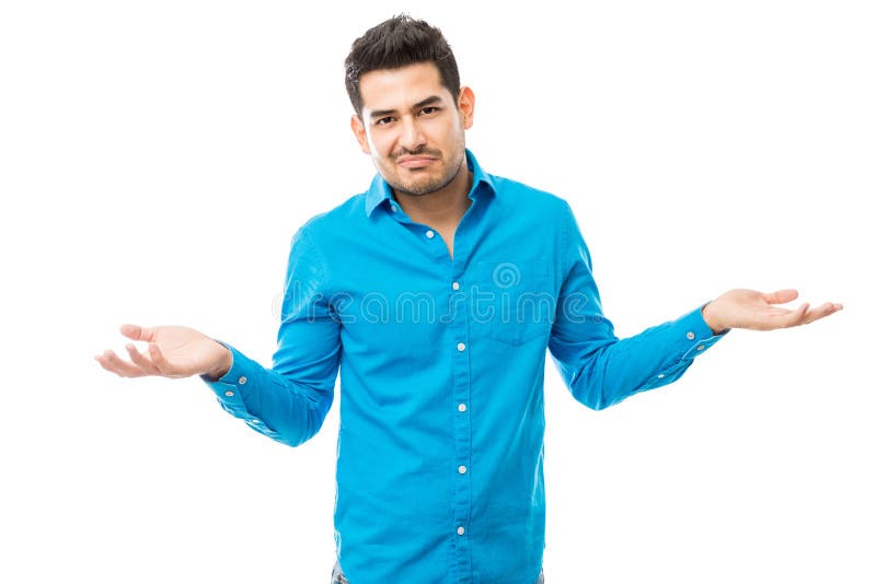 Unsure Man Wearing Blue Shirt While Shrugging His Shoulders